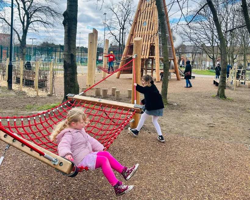 Natural wooden climbing play structures.