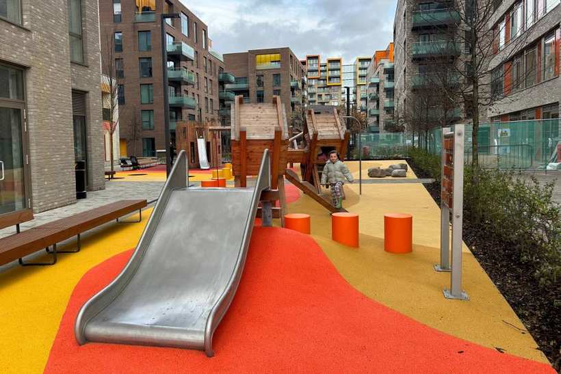 Bright, soft safety surfacing under play equipment.