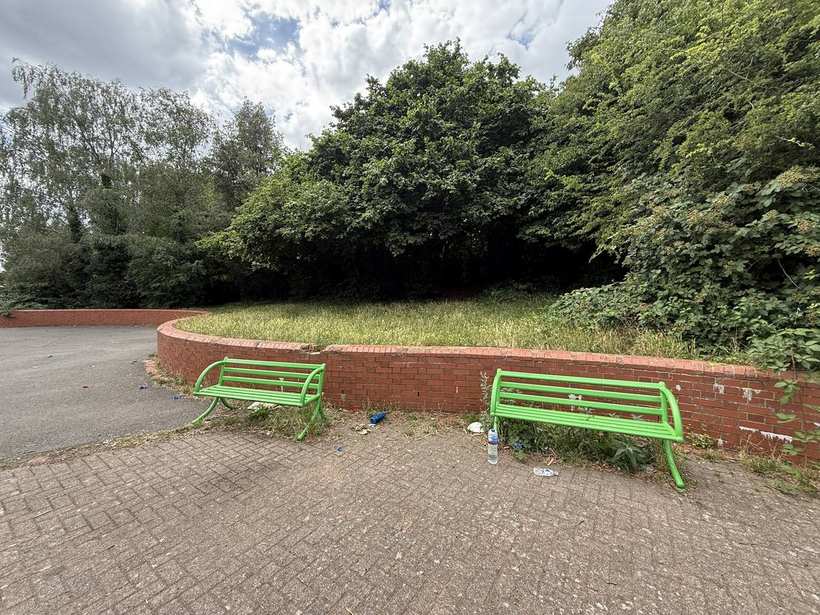 Worn benches and tired, aged play surfacing.